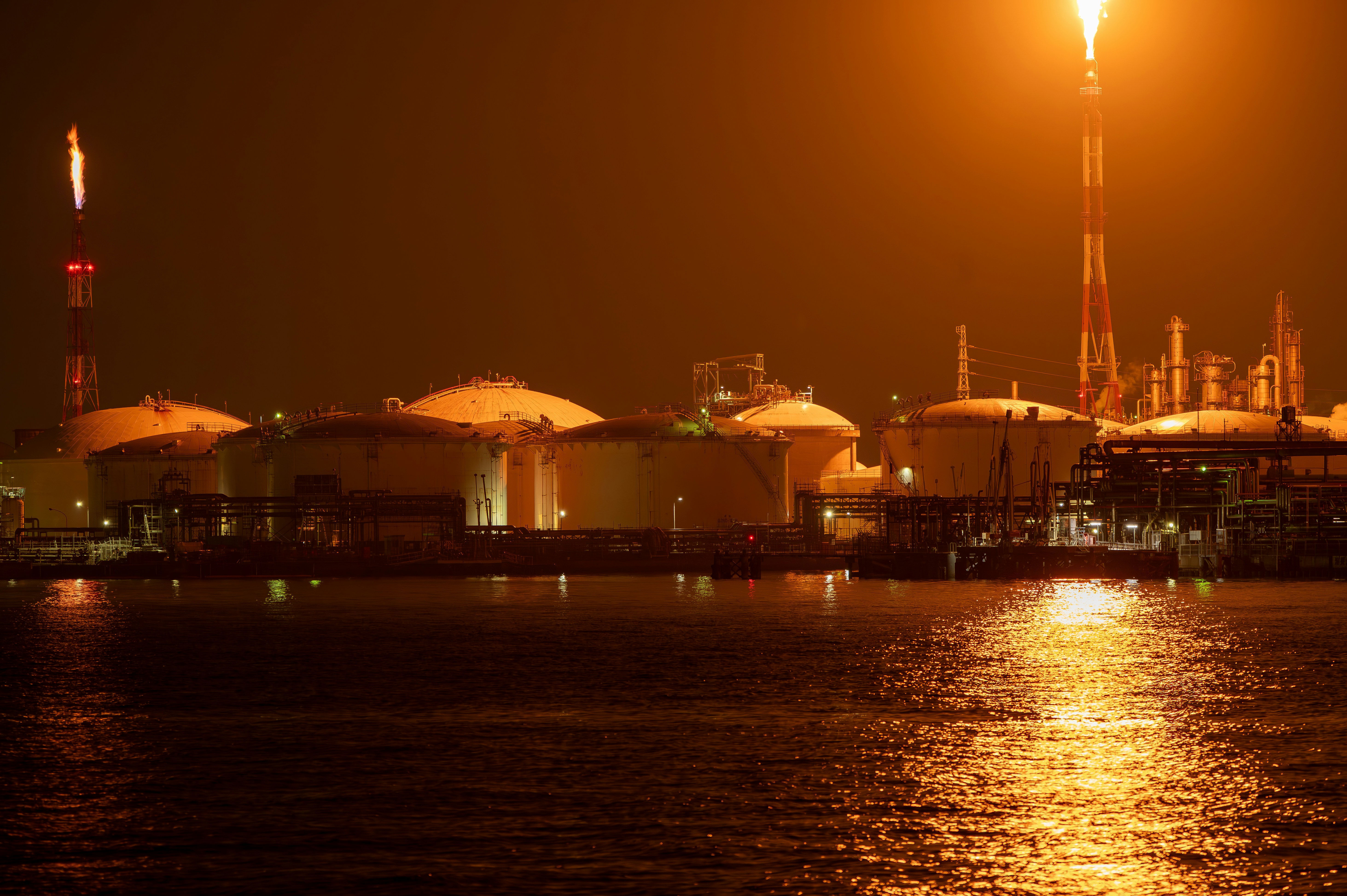 Illuminated oil refinery plant at night